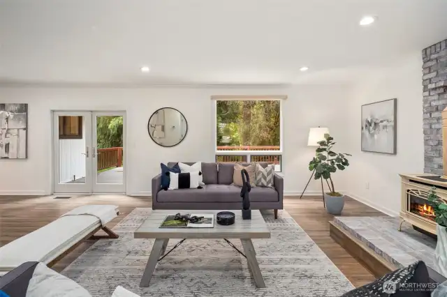 This living area offers effortless flow to the outdoors. The French doors lead directly to the deck, perfect for entertaining or relaxing in a private setting.