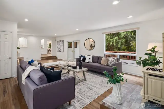 Spacious and thoughtfully designed, warm wood-toned flooring adds to the inviting feel, while subtle architectural details enhance the charm of the space.