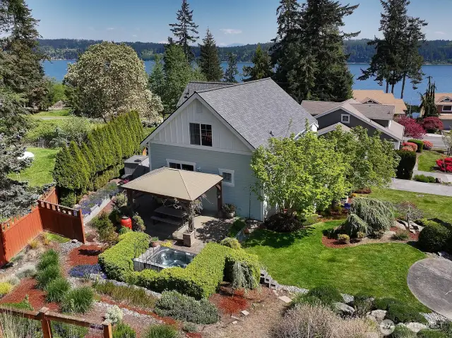 Exquisitely landscaped, you will love your own private oasis with a hot tub and covered patio. Rumor has it that this Bungalow has the most privacy in the neighborhood.