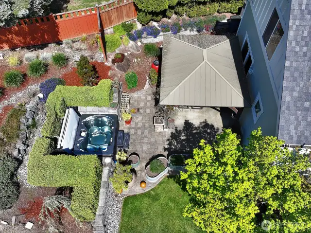 From above. Expansive patio with a spacious hot tub and a gazebo. Plenty of space to entertain or retreat with a good novel.