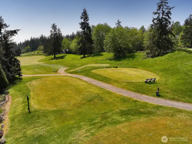A lovely buffer to your yard, the expansive green of the golf course.