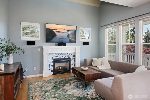 Vaulted ceilings and windows galore make your main living area bright and spacious. Propane fireplace to cozy up on those chilly Island evenings. Sound system and tv convey.