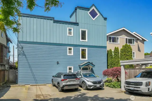 Your parking spot, second from the left. You can also access the side yard, large storage shed, and your patio from the gate on the left