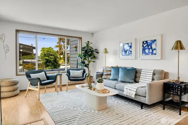 Light and bright, the open-concept living space flows out onto an oversized patio perfect for summertime entertaining and sunset gazing!