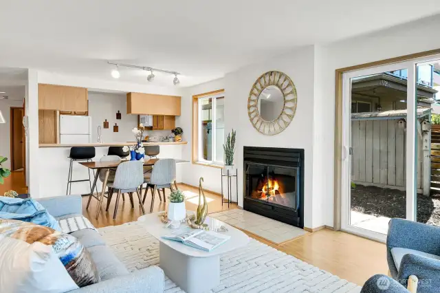 Notice the additional bar seating, large dining table, and wood-burning fireplace for those cozy, drizzly evenings.