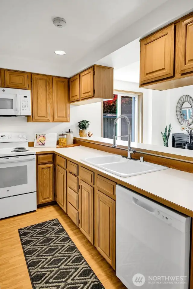 New appliances and fixture updates make this modest, functional kitchen sparkle!