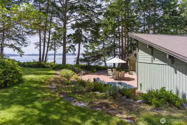Westside, all cedar beach house tucked at the end of a quiet road offers 295 ft of waterfront & views over San Juan Channel, the Straits & Olympic Mtns.