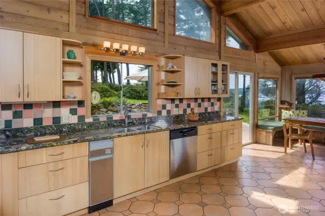 Spacious kitchen with lots of granite counter space and good views from the sink.