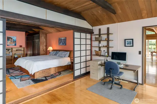 Den/office is separated from the primary bedroom with Asian style sliding doors.