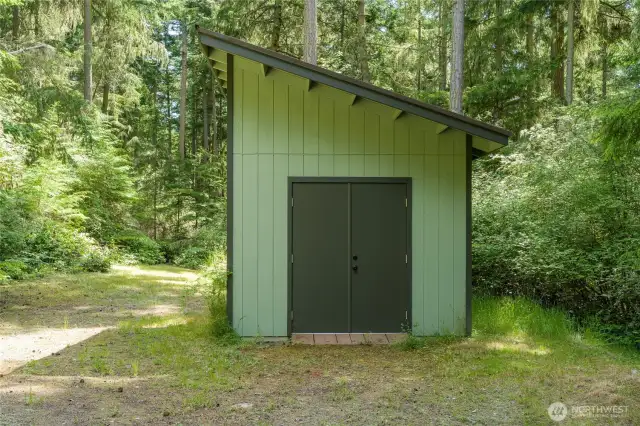 Level area next to the storage building would be a good spot to add a carport.