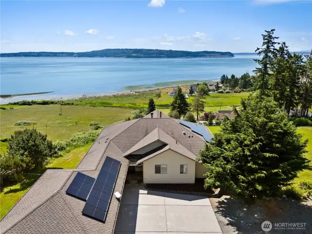 Unobstructed, Sweeping Saltwater Views from every room!  Active Solar Panels, lots of extra parking on over two acres.