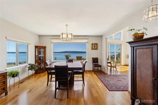 Here is another photo of the Dining Room.  You can enjoy the views from both the large picture window and the side window.  Don't those hardwood floors look great?