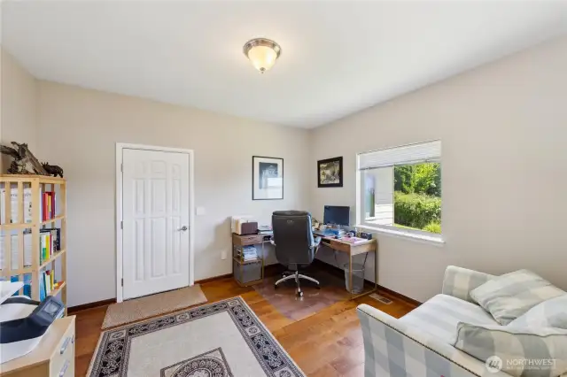 This is the Office/Den space.  That door leads to the Garage.