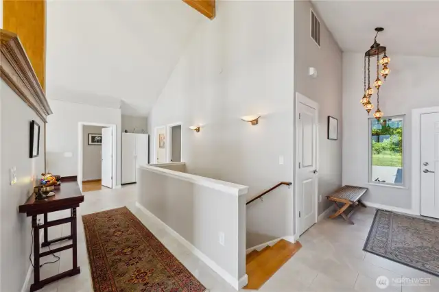 Here is a photo of the entrance and coat closet.  That open door at the very end is the Primary Suite.  The first  open door on the right side is the Guest Bedroom with a full bathroom.  The second door is another Guest bathroom.