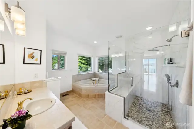 The Primary Bathroom has a Luxury tiled shower, jetted soaking tub, and lots of windows for natural light.