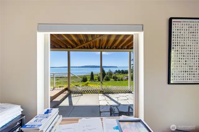 This is from the Bonus Room on the lower level.  You can see the stone sitting area, deck, patio and view.  The Hot Tub is on the left side, out of view.