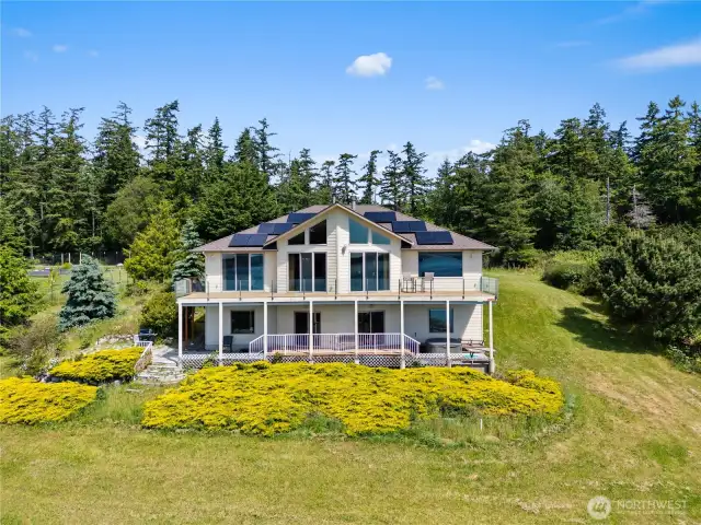 This is taken from the water side.  You can see that this home was designed, "sited" and built to take full advantage of the amazing saltwater views and marine activity.