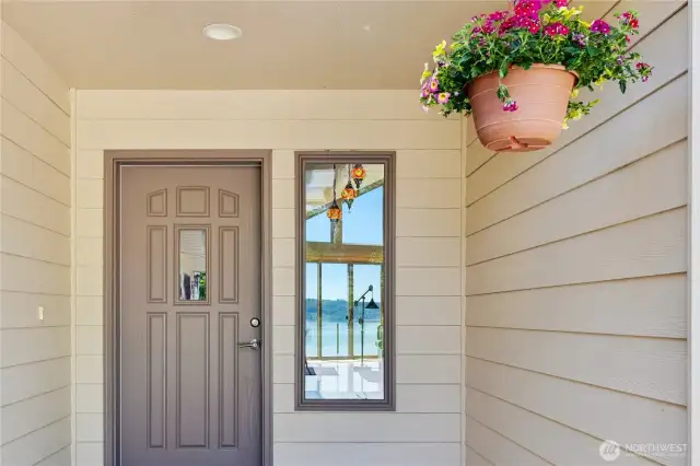Here is the front door entrance.  If you look, you can see the views through the side glass!  There is a skylight above allowing more natural light.