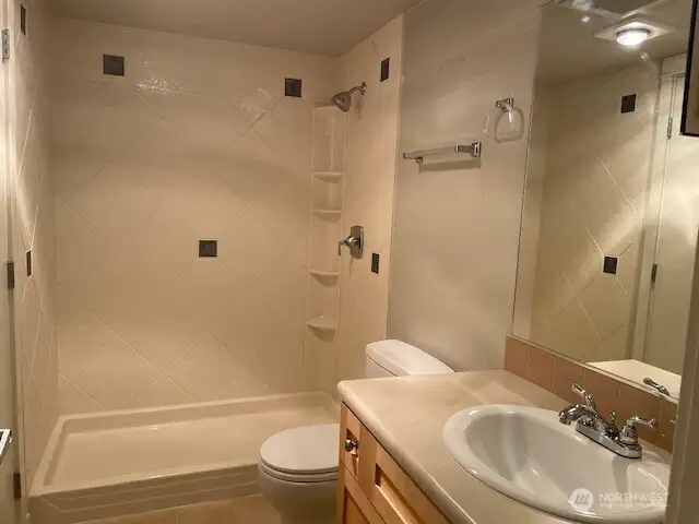 Bathroom has a new shower installed and separate vanity