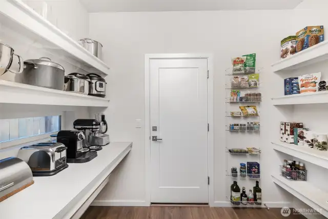 The butler’s pantry provides ample storage for small appliances and pantry overflow—keeping your kitchen organized and clutter-free.