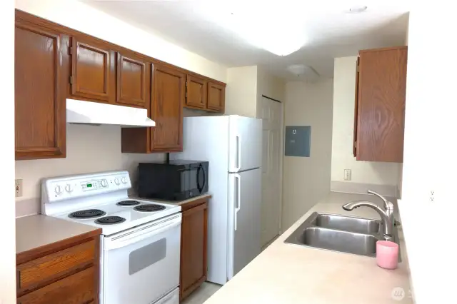 Nice and clean kitchen with plenty of cabinet space.