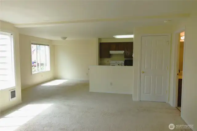 Spacious and light-filled living room with dining room.