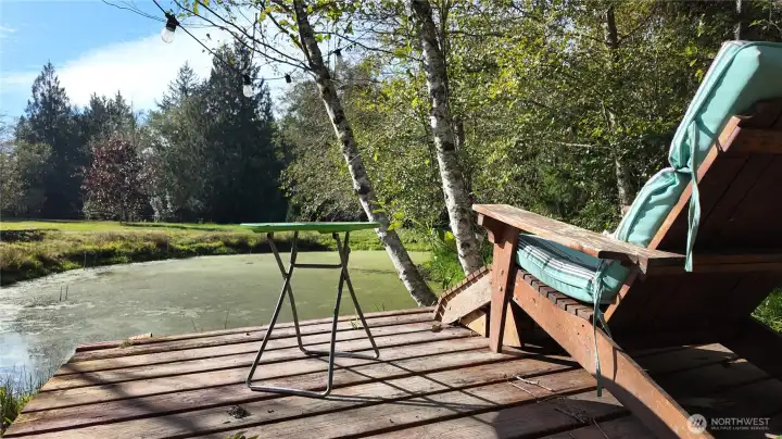 A deck on the island with seating, doesn't it feel tranquil, even through the picture.