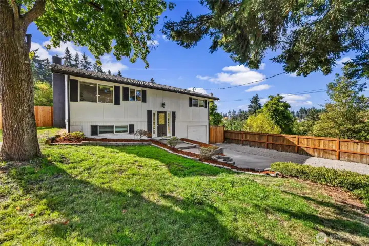 Professionally landscaped grounds create a stunning first impression from the street.