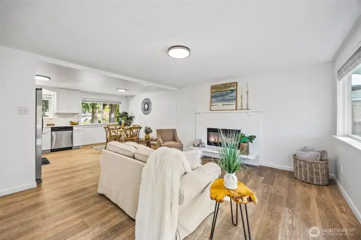The open layout and natural light make the living, kitchen, and dining areas feel spacious and connected.