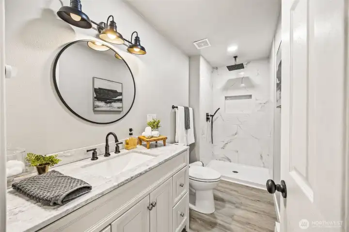 Modern lower-level bathroom with tasteful finishes.