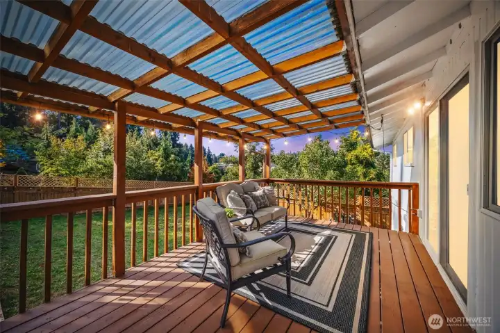 Updated covered deck provides a great space overlooking the yard.