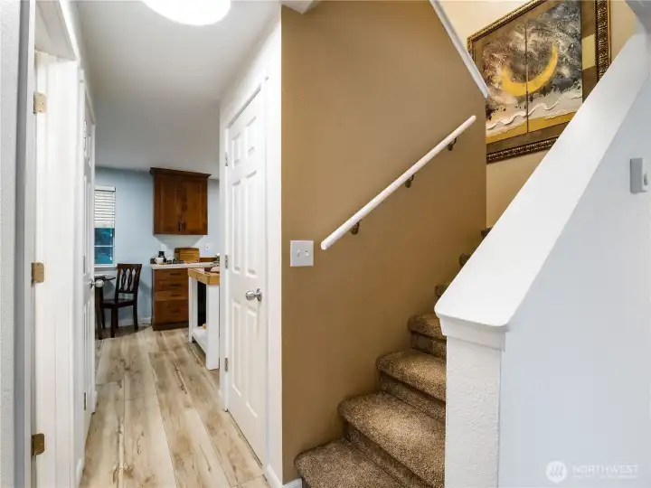 The open stair case to the bedrooms is located in the center of the home