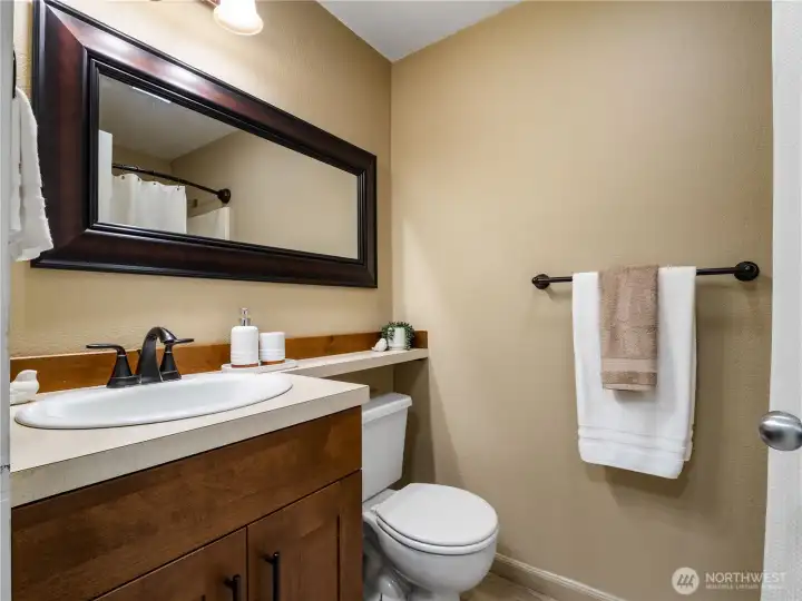 On the main floor by the staircase, youll find a 3/4 bath with walk in shower
