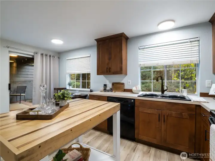 The view from the kitchen into the wooded back yard is beautiful any time of year