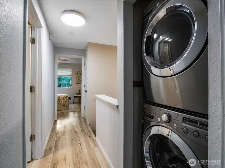 You'll find the laundry upstairs, between the two bedrooms