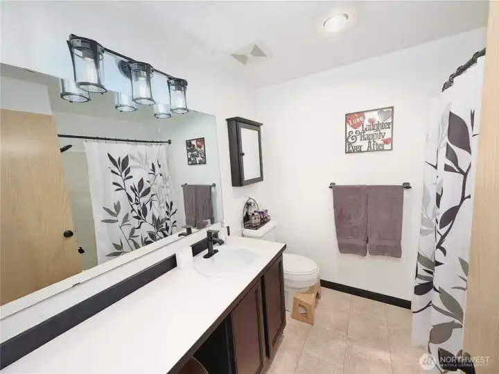 upper level bathroom with tub and shower