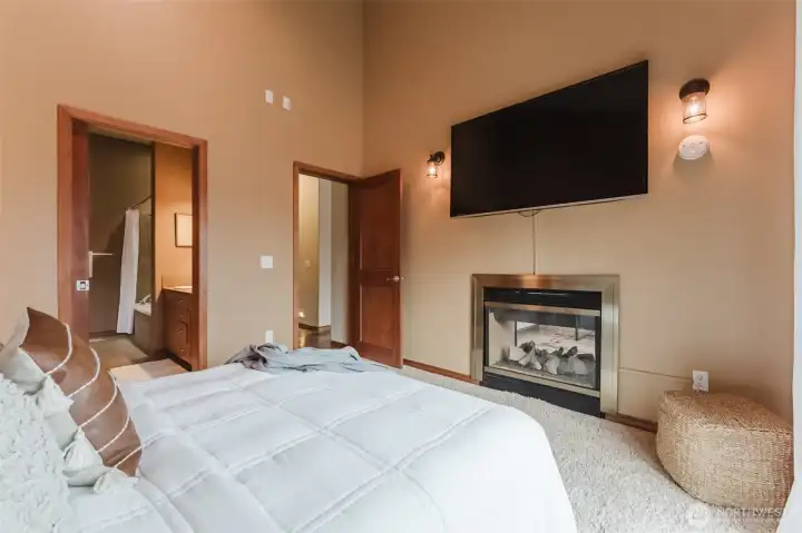 More vaulted ceilings in the primary bedroom give it so much height