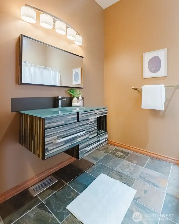 A guest 3/4 bathroom just off the hallway