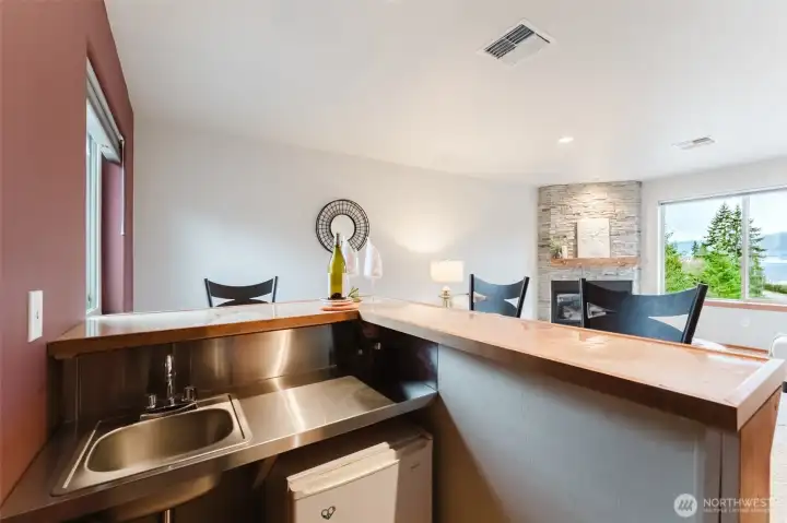 Upstairs a recroom has built-in wetbar