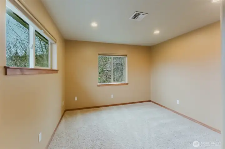 A secondary bedroom on the upper level of the home