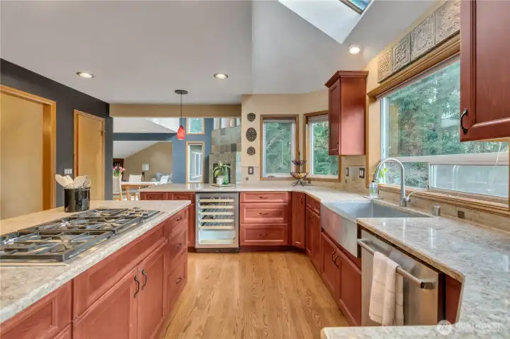 Sleek farmhouse style stainless steel sink & Bosch dishwasher.