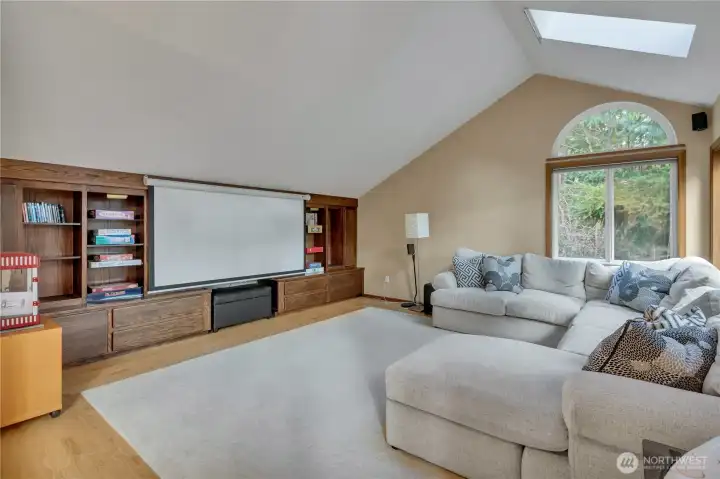 The family room boasts a projector media set up for fun movie nights