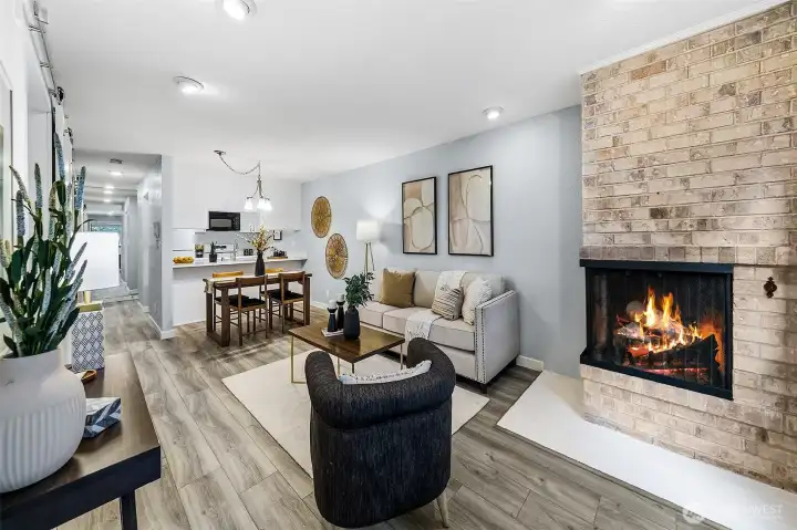 Another view of the full living area and cozy wood-burning fireplace.