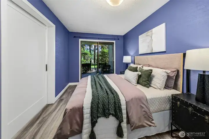 Large bedroom with access to patio. Plenty of space for a king-sized bed.