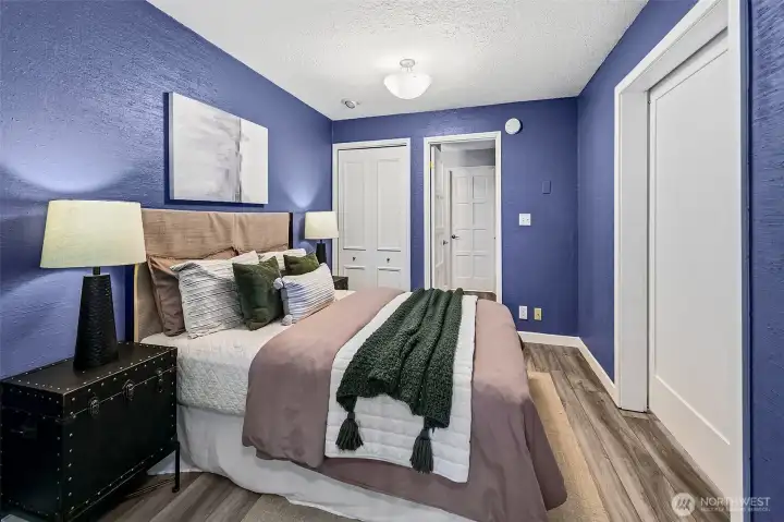 View from the bedroom towards the bathroom and 2 closets.