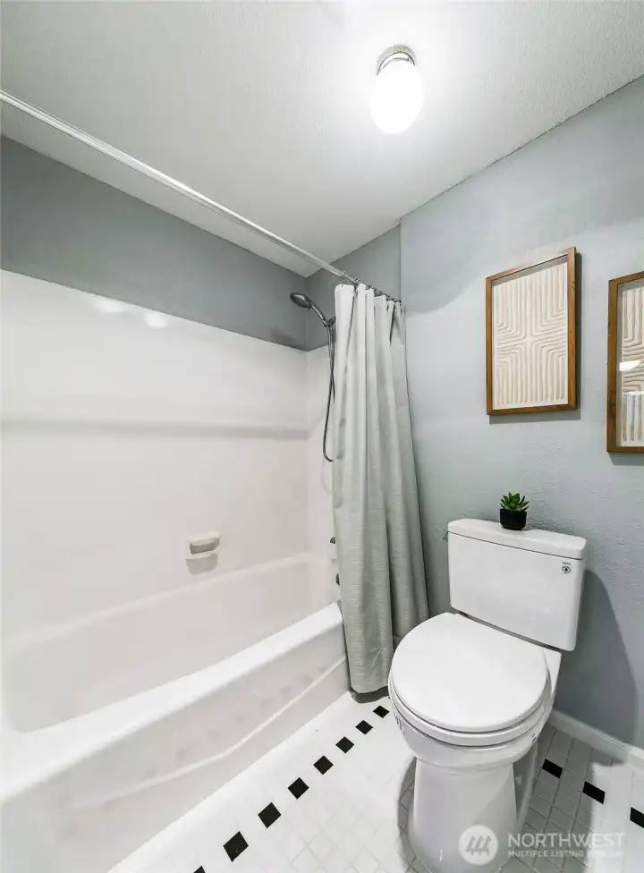 Enclosed toilet and shower/tub