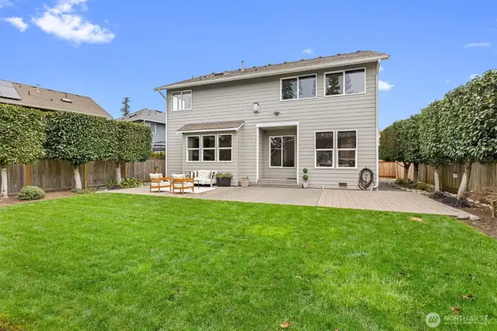 Lush, level lawn space ideal for outdoor activities, play, or simply enjoying the Pacific Northwest setting.