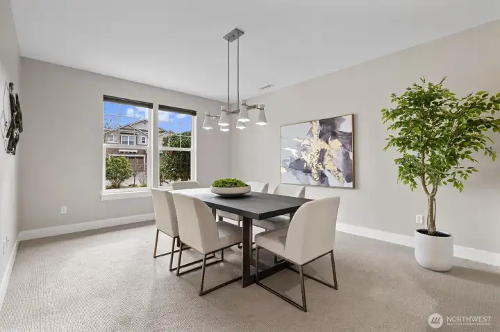 Versatile dining or flex space just off the entry, perfect for formal dining, home office use, or additional living area, enhanced by natural light and open flow.