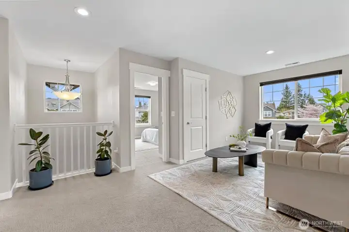 Versatile loft space with skylights and closet, ideal as a home office, reading nook, or potential fourth bedroom conversion.