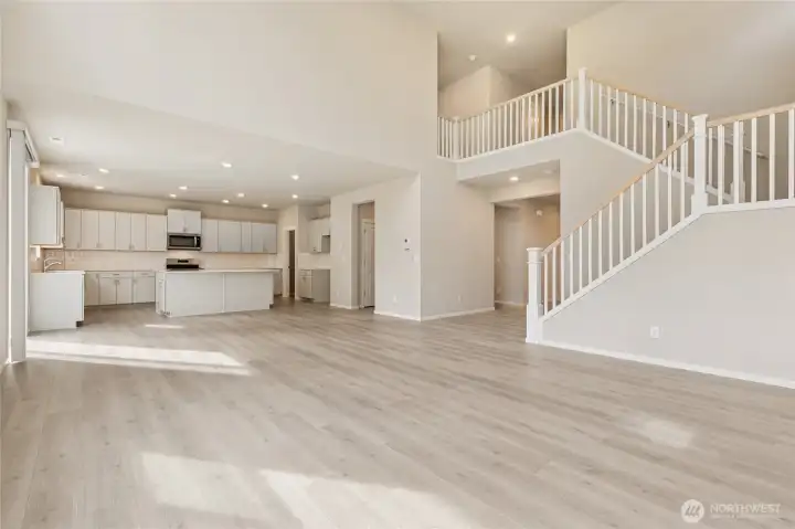 Impressive open-concept view showcasing the kitchen and open staircase. Photos are representative only and may display different color package and/or upgrades.